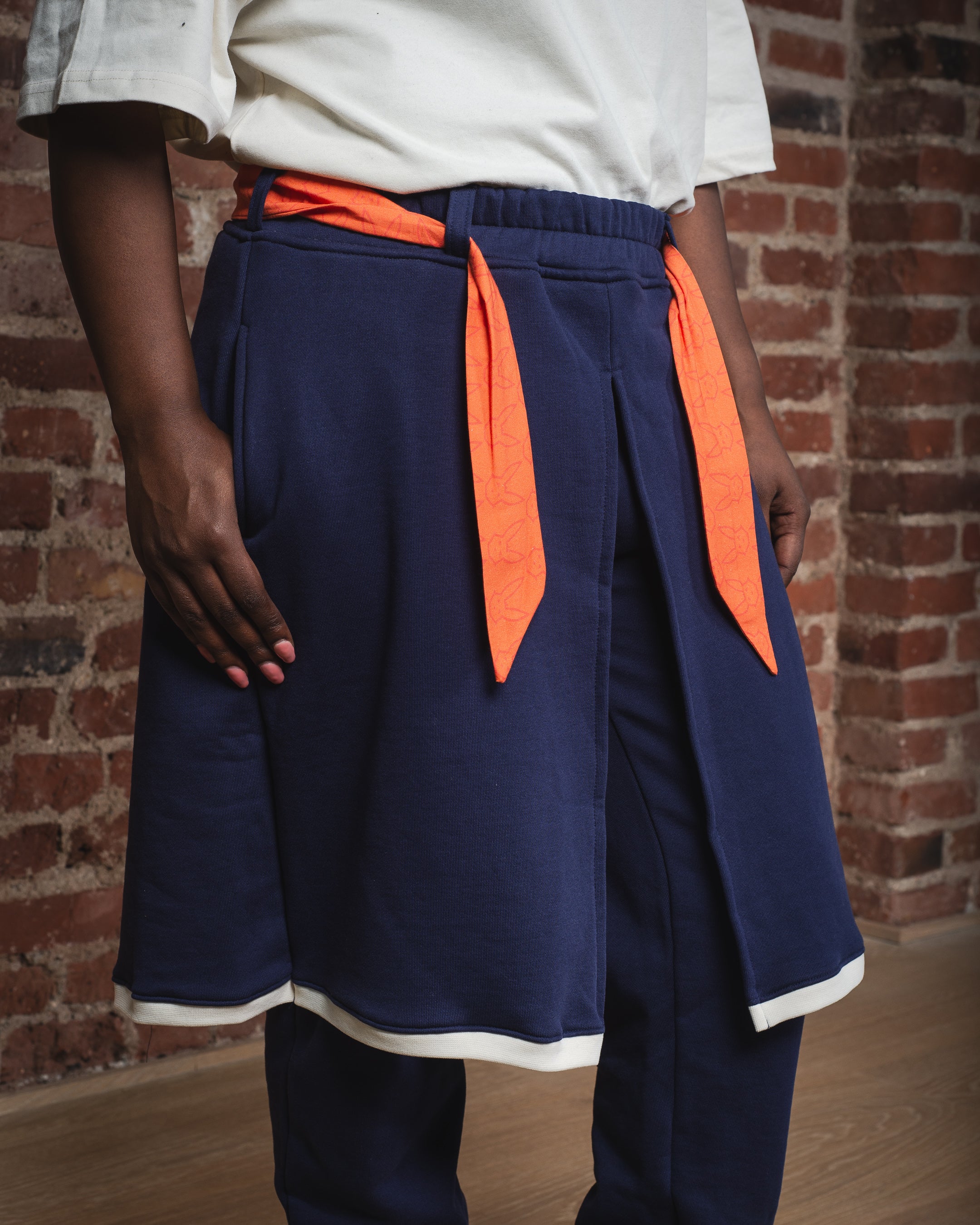 SWEATPANTS WITH SKIRT LAYER AND CONTRAST DETAILS